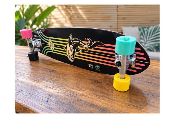 globe skate with colourfull wheels on a wooden table in Mojokite Bar